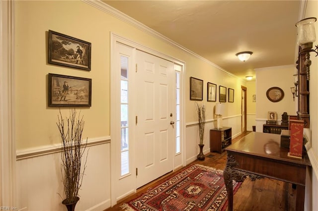 foyer entrance featuring crown molding and dark wood-type flooring