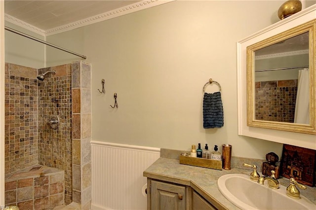 bathroom with walk in shower, ornamental molding, and vanity