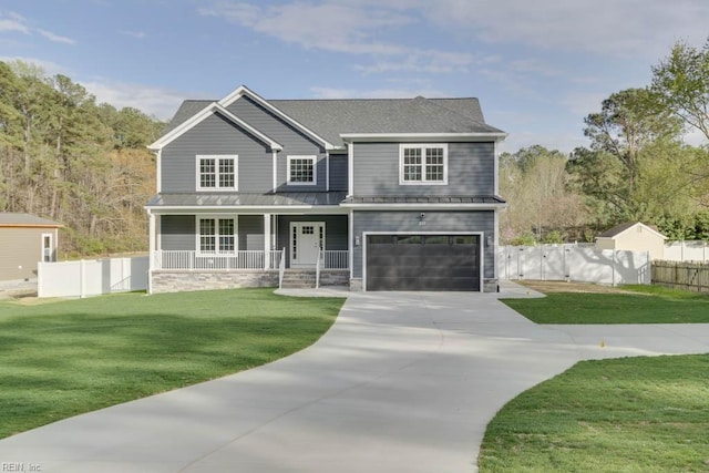 craftsman inspired home with a porch, a front yard, and a garage