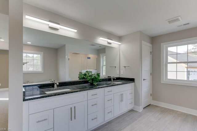 315 Dare Rd, Yorktown, VA 23692 - bathroom featuring double sink vanity and hardwood / wood-style floors