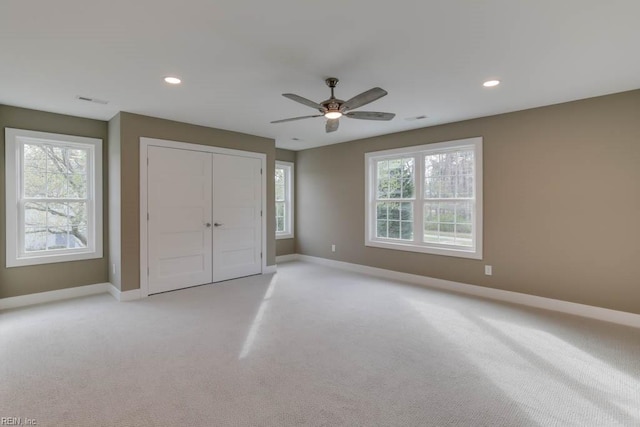 315 Dare Rd, Yorktown, VA 23692 - unfurnished bedroom with a closet, light colored carpet, and ceiling fan