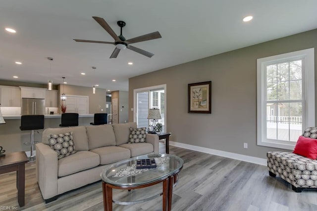 315 Dare Rd, Yorktown, VA 23692 - living room featuring ceiling fan, a wealth of natural light, and light hardwood / wood-style floors