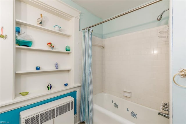 bathroom with radiator and shower / bathtub combination with curtain