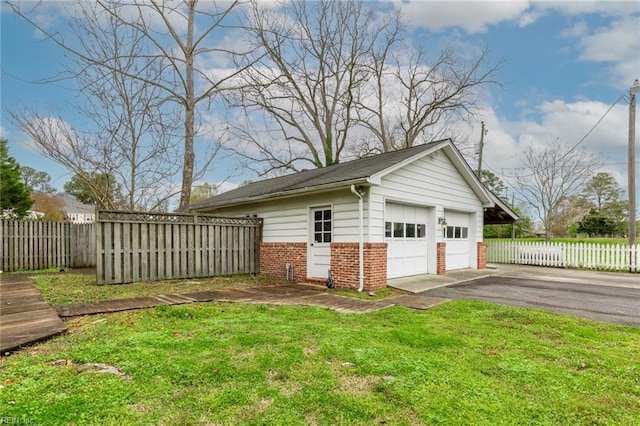 garage with a lawn