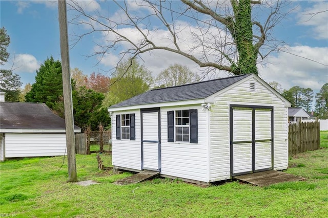 view of outdoor structure with a lawn