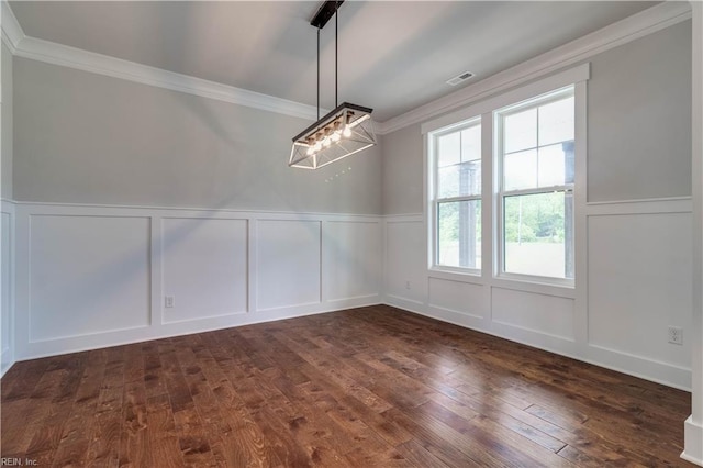 unfurnished dining area with crown molding, dark hardwood / wood-style flooring, and a notable chandelier