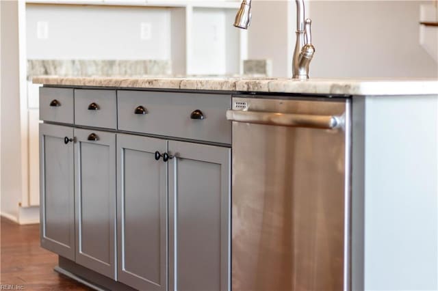 room details featuring dark hardwood / wood-style flooring and dishwasher