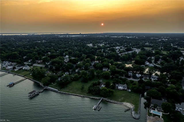 aerial view at dusk with a water view