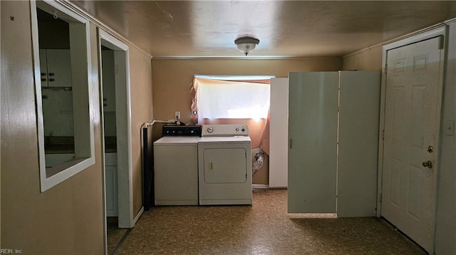 clothes washing area featuring independent washer and dryer