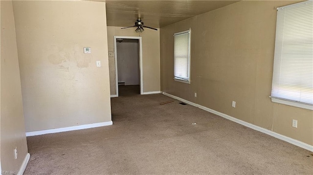 carpeted empty room with ceiling fan