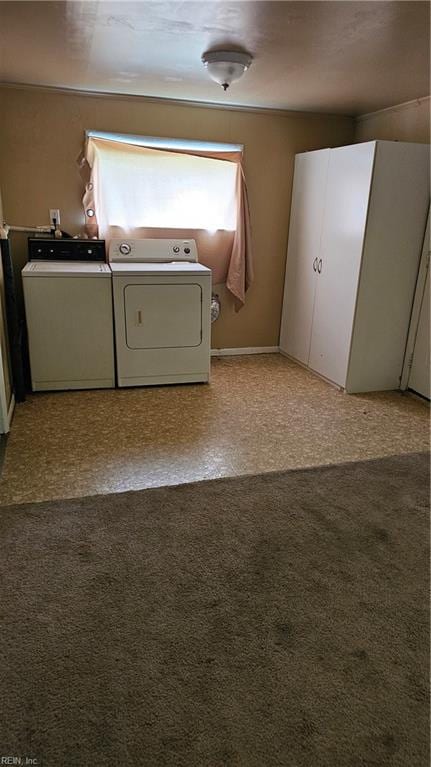 laundry room with light colored carpet and independent washer and dryer