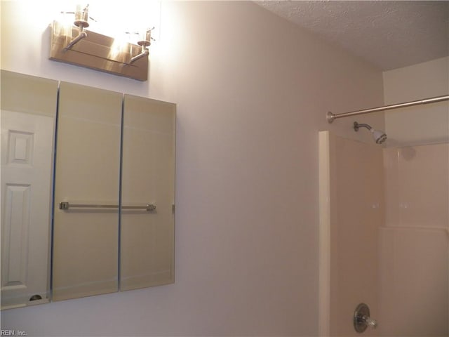 bathroom featuring a textured ceiling