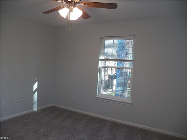 empty room featuring ceiling fan, a healthy amount of sunlight, and carpet floors