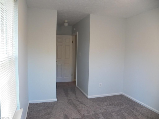 unfurnished room with carpet floors