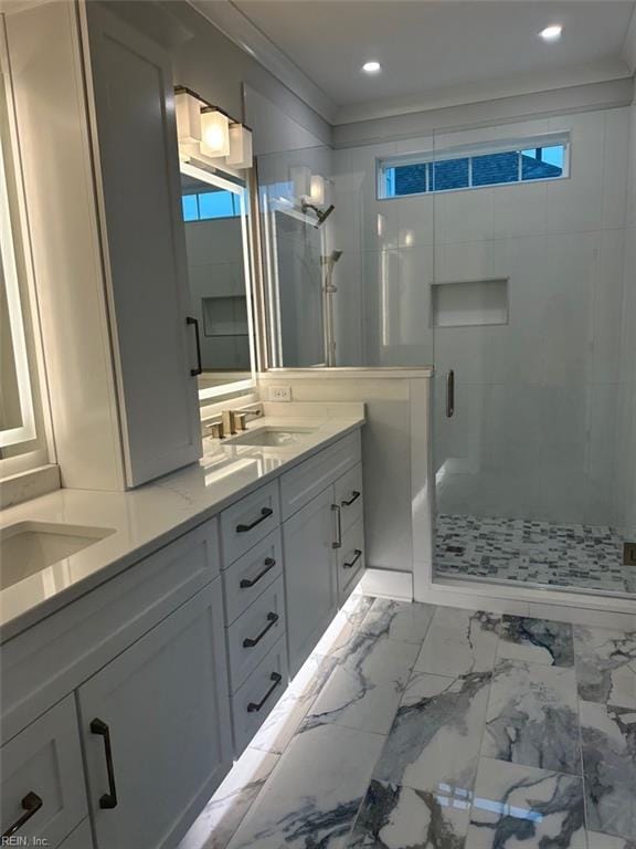 bathroom with vanity and a shower with shower door