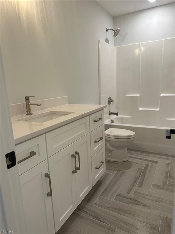 full bathroom with shower / washtub combination, vanity, and toilet