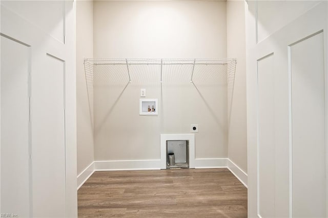 laundry area featuring hardwood / wood-style floors, washer hookup, and hookup for an electric dryer