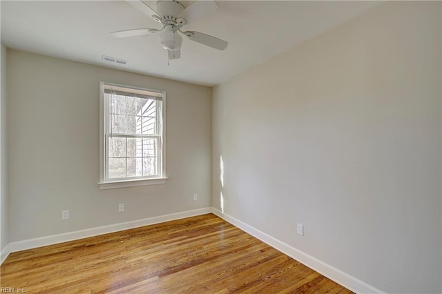 unfurnished room featuring ceiling fan and light wood-type flooring