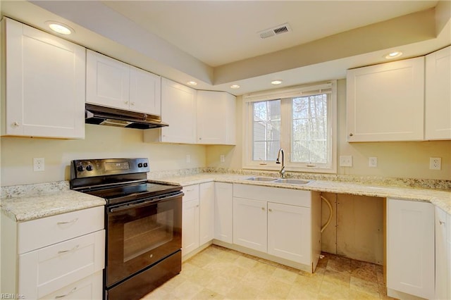 kitchen with white cabinetry, electric range, and sink