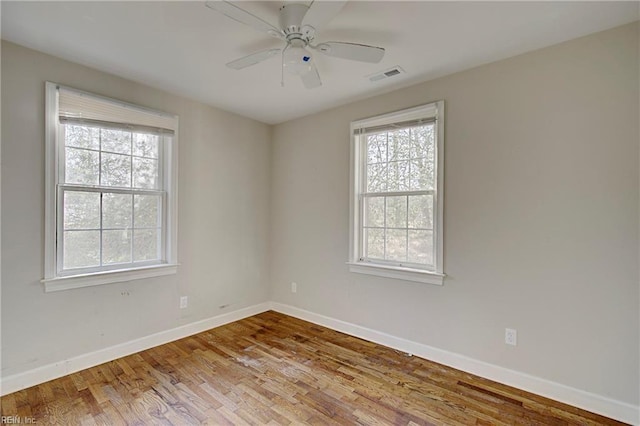 empty room featuring ceiling fan and light wood-type flooring