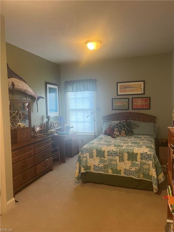 bedroom with light colored carpet