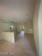 kitchen with light hardwood / wood-style floors and light brown cabinets