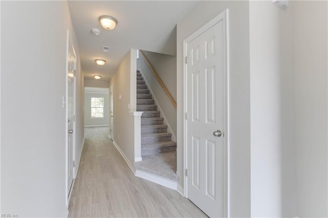 hall with light hardwood / wood-style floors