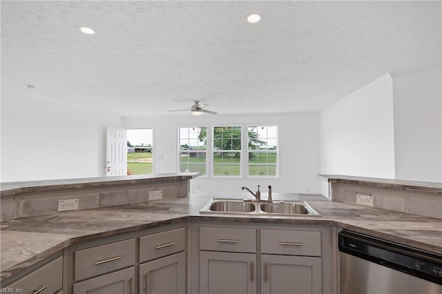 kitchen featuring ceiling fan, stone counters, dishwasher, a textured ceiling, and sink