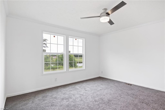 empty room with carpet, ceiling fan, and crown molding