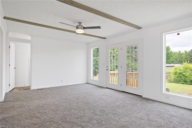 carpeted spare room featuring ceiling fan