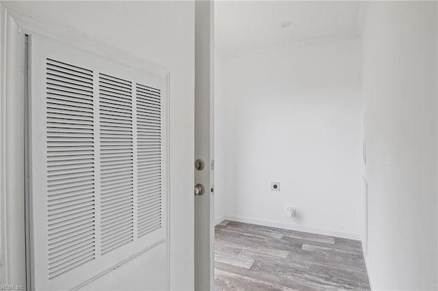 interior space with ornamental molding, hardwood / wood-style floors, and electric dryer hookup