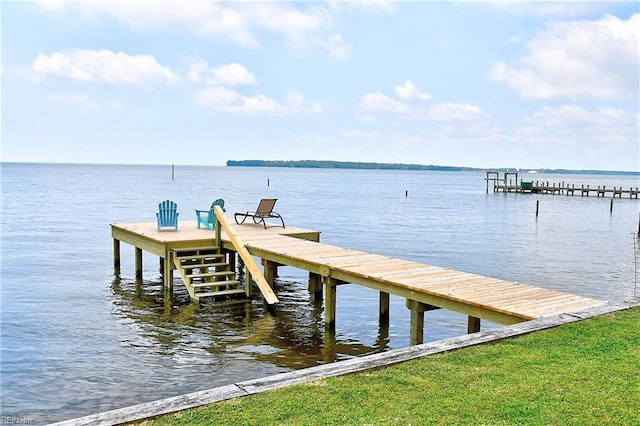 dock area with a water view