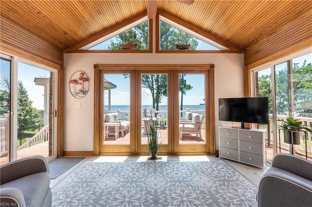 interior space with wood walls and high vaulted ceiling