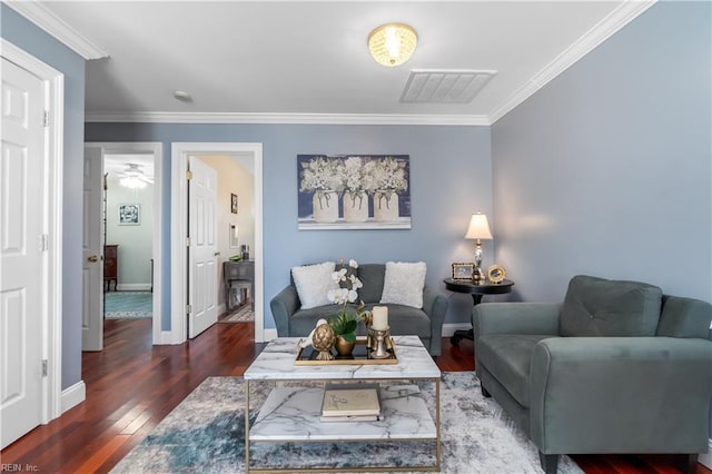 living room with dark hardwood / wood-style flooring and crown molding