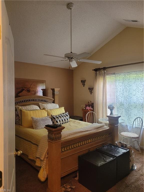 carpeted bedroom featuring a textured ceiling, ceiling fan, and vaulted ceiling