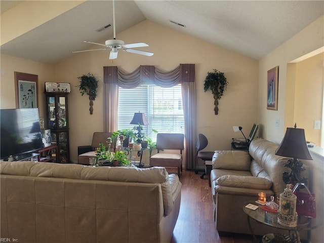 living room featuring vaulted ceiling, hardwood / wood-style flooring, and ceiling fan