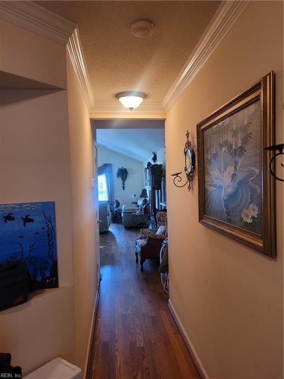 hall with crown molding, a textured ceiling, and hardwood / wood-style flooring