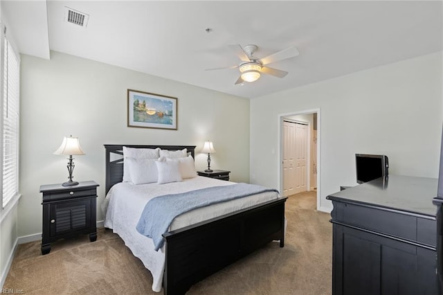 carpeted bedroom with ceiling fan