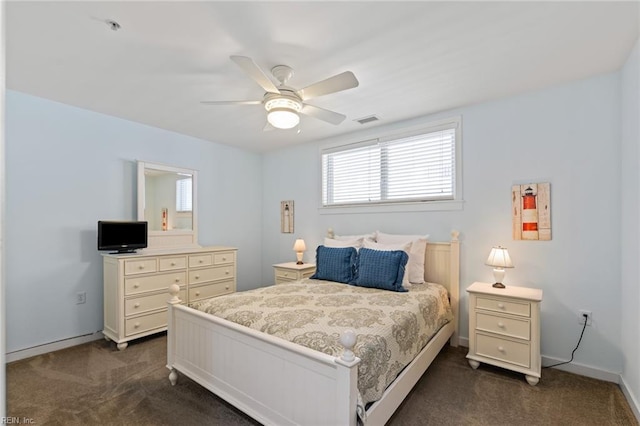 bedroom featuring dark colored carpet and ceiling fan