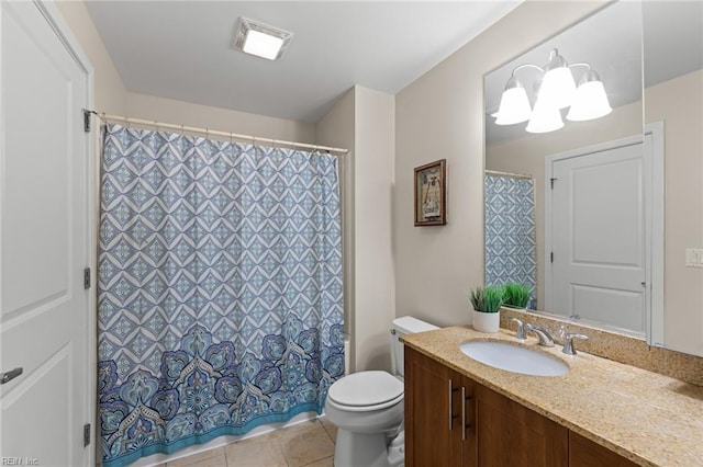 bathroom featuring an inviting chandelier, vanity, toilet, and tile patterned flooring