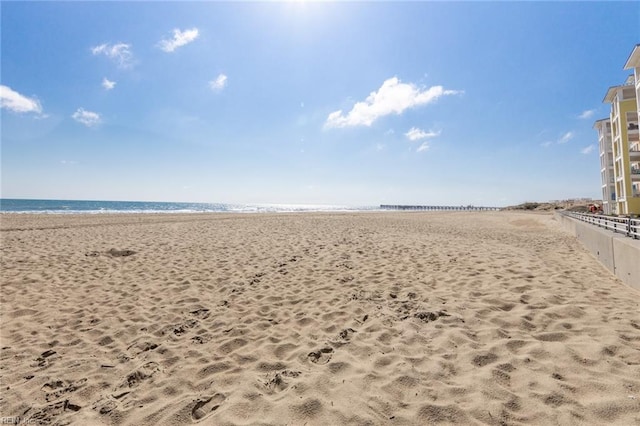 view of property's community featuring a view of the beach and a water view