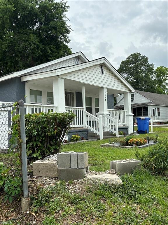 rear view of house with a porch