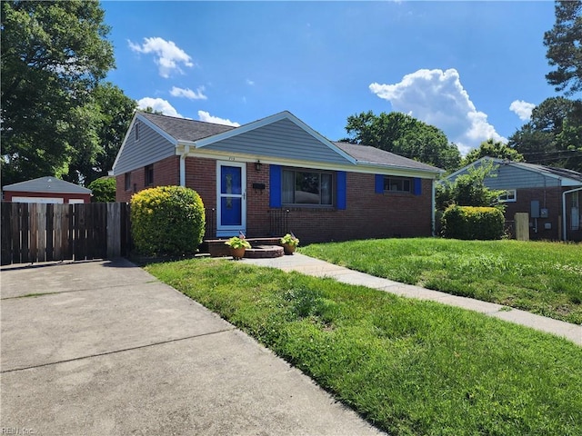 ranch-style home with a front lawn