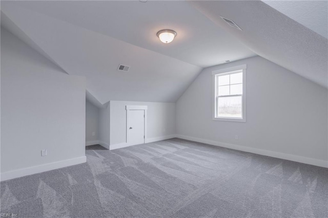 bonus room featuring carpet and vaulted ceiling