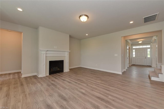 unfurnished living room with wood-type flooring