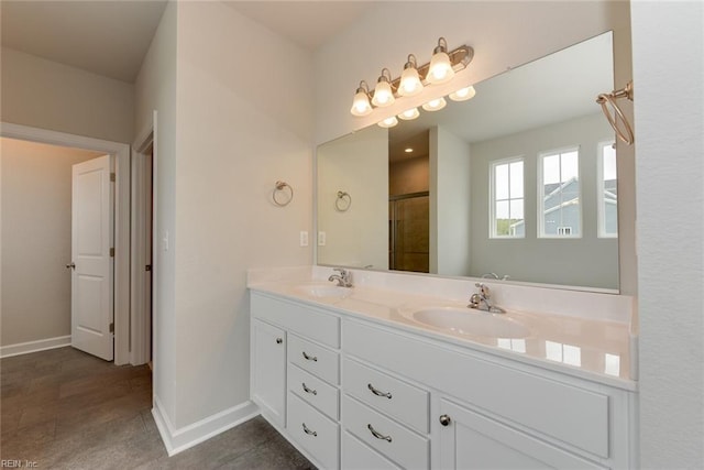 bathroom featuring vanity with extensive cabinet space, double sink, and tile floors