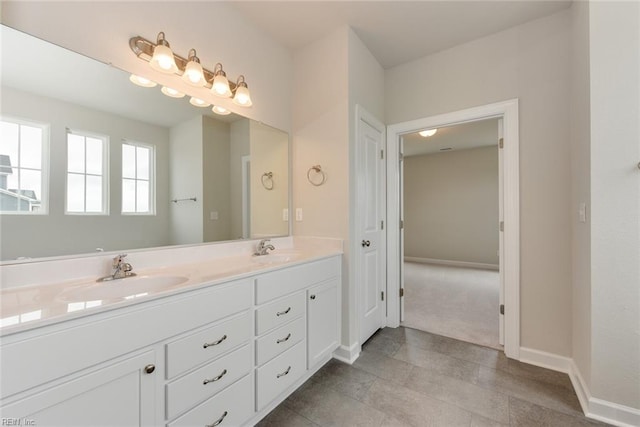 bathroom featuring tile flooring, dual sinks, and large vanity