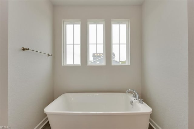 bathroom with a tub