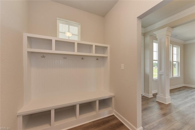 mudroom with hardwood / wood-style floors and decorative columns