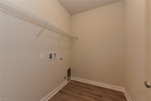 washroom with dark wood-type flooring, hookup for an electric dryer, and washer hookup